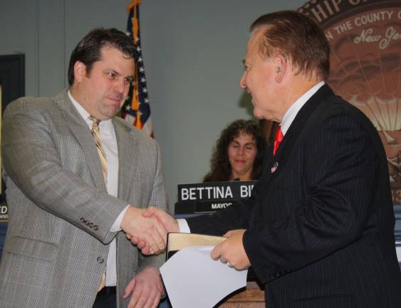 I do solemnly swear... Pennacchio congratulates Hensley.
