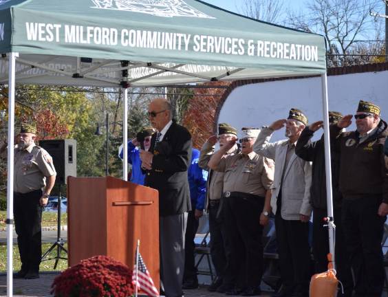 Glenn Wenzel, emcee of the Veterans Day ceremony, leads the Pledge of Allegiance.