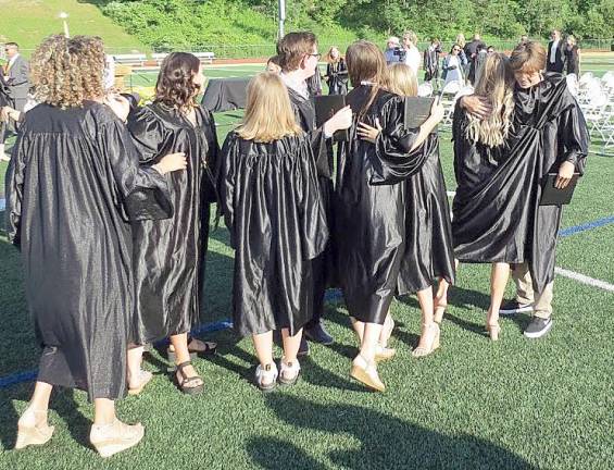 Following the ceremony, the newly promoted students shed a few tears, shared a few hugs and took a few photos with their classmates.