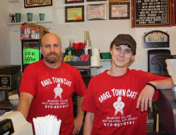 There’s nothing like a New York bagel Bagel Town Cafe owner, Paul Schreiber, on left and Bagel Town worker, Trevor Simon, are ready to serve their customers with a smile.