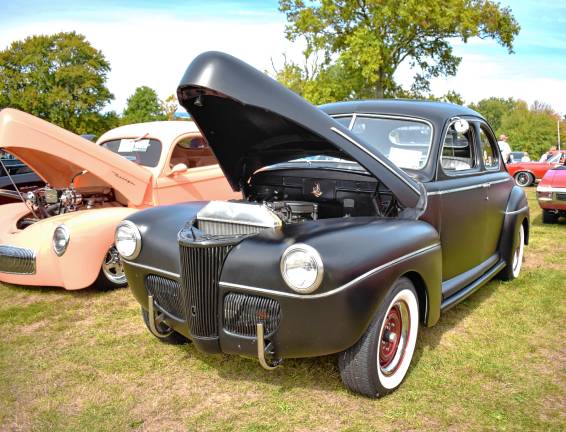 Car show attracts 400 1941 Ford Coupe with a satin finish next to a Willys coupe from the same era.