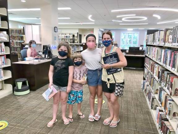 West Milford. The library is back in business West Milford Township Library just opened its doors again to the public last week - with some limitations. The building closed for quarantine in March, but now has begun its summer programs. Visitors to the West Milford Township Library must wear a mask or face covering and are asked to spend no more than 30 minutes in the building. Patrons can access and check out from all library collections, use the public WiFi and computers, as well as take advantage of contactless pickup for all library materials. Photo provided by Elyse Schear, Adult/Teen Services Librarian.