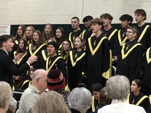 Choir, band entertain seniors HP2 Dwight Weaver, left, conducts the West Milford High School Highlands Chorale Concert Choir at the township Recreation Center. About 150 senior citizens attended the performance and pizza lunch afterward.