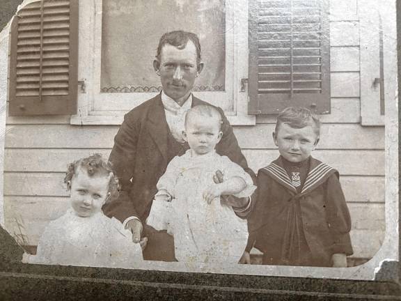 Looking back: Mathews family history John F. Mathews (1871-1934) of the Apshawa section of West Milford, with three of the five children born to him and the late Martha Gormley Mathews (1882-1958). From left are Verina Agnes, Anna Elizabeth and Albert Vincent. They are in front of the family farmhouse on Weaver Road about 1905. (Photo provided)