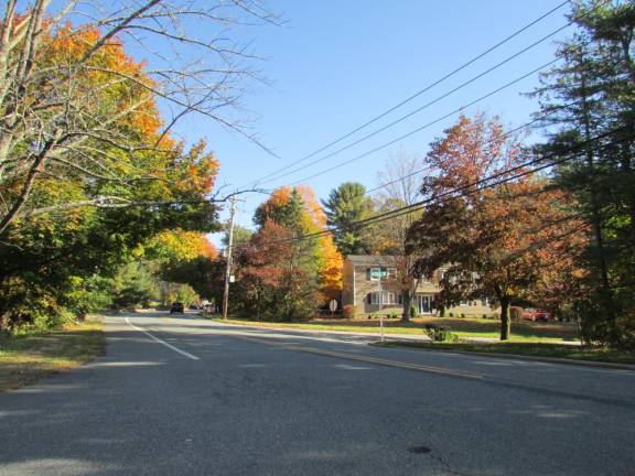 In the distance a car rounds a dangerous bend on Macopin Road north of the Arundel Road entrance to the Old Milford community (pictured), where some officials believe that a lower speed is needed for safety. There were not enough council votes to lower any of several areas proposed for lower speeds along what has become a heavily traveled commuter road