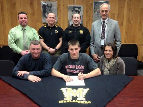 Noah Provenzano signed a letter of intent to play football with Division 1AA Sacred Heart University, located in Fairfield, Connecticut, in the fall. Provenzano had a celebrated career on the gridiron here in West Milford, playing safety for his first two years of high school and then switching to corner. Seen here with Noah are his parents, David and April, and, from left in back, West Milford Athletic Director Joe Trentacosta, assistant football Coach Steve Maslanek, head football Coach Donald Dougherty and West Milford High School Principal Fred Hessler.
