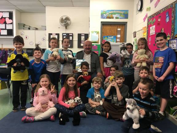 West Milford celebrates 'Read Across America' Board of education President Jim Foody spent some time at a few schools reading. Here he is seen with an Apshawa class March 2, Read Across America Day.