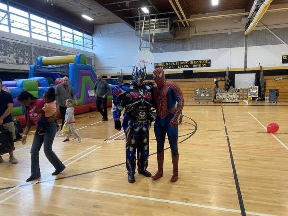 HF3 Children had a chance to meet superheroes and to play in an elaborate bounce house at the event, held in the Macopin Middle School gym.