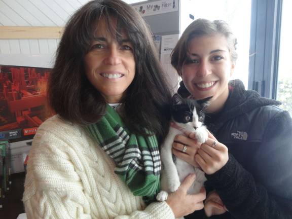Mohawk House goes to the dogs for O.S.C.A.R. fundraiser Yvette and Sirena Adessa, of Sparta, get to know Deetle the kitten.