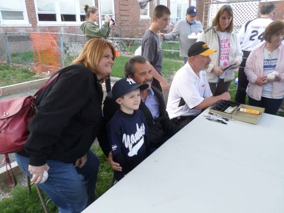 Yankees legend kicks off Little League West Milford Little League player Cody Trusz, 5, of the Yankees takes a picture with his mother Debbie and Yankees legend Ron Guidry at Hillcrest Field last week. Photo by Nathan Mayberg