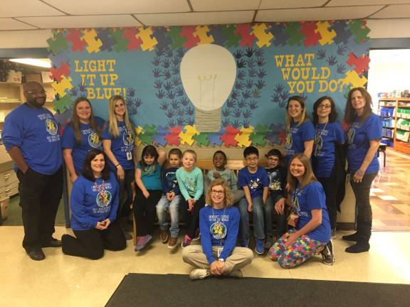 District 'lights it up blue' for autism awareness Students and staff of the ABA program at Marshall Hill proudly display their 'Light it up Blue' bulletin board, bringing attention to autism.