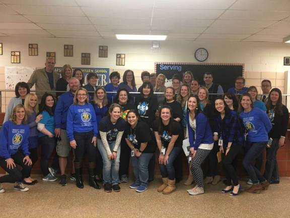 District 'lights it up blue' for autism awareness Apshawa staff.