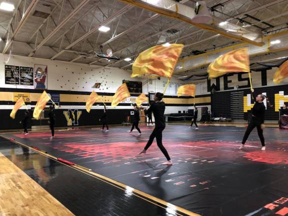 Color Guard members perform with flags for the judges. (Photo by Kathy Shwiff)