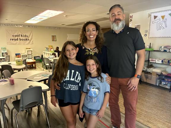School options ‘born from necessity’ Roots & Wings Founders Jenny and Burton Mills with their daughter Talula, 10 (left) and another student.