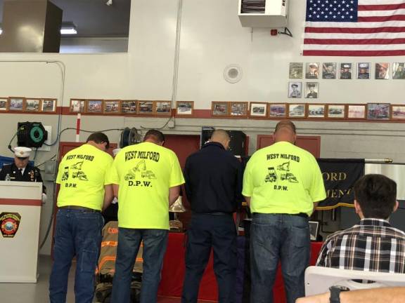 Employees of the West Milford Department of Public Works, which was led by Edward Steines, pay their respects.