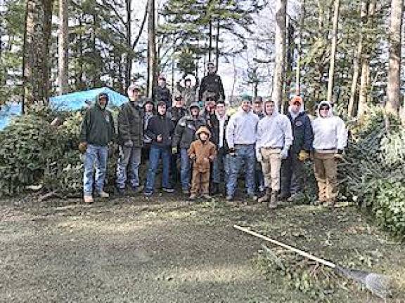 Troop 151 collecting used holiday trees