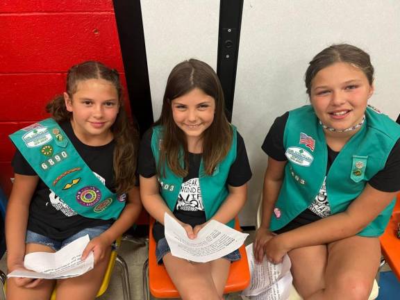 Lily Santiago, Kaitlyn Donaldson and Sony Lynn Hart are members of Girl Scout Troop 97403.