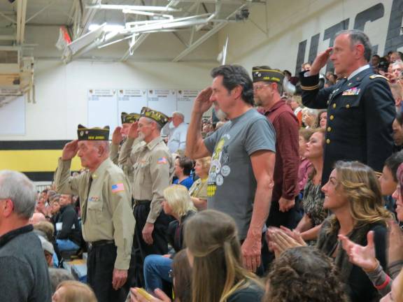 Highlanders' Tattoo is a real crowd pleaser Veterans in the audience rose and saluted during their branch's anthem.