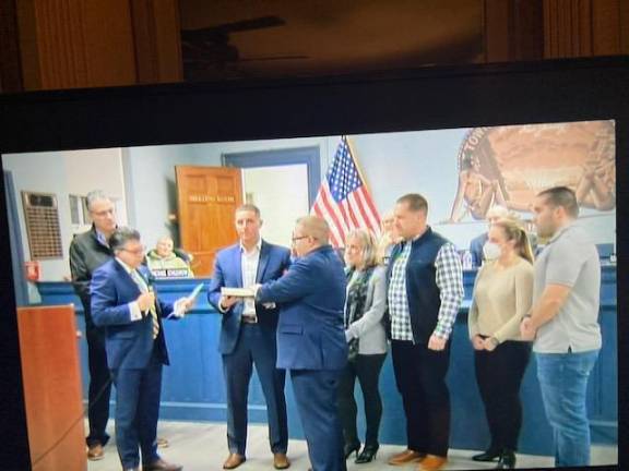 West Milford hiring company to clean up municipal sites Newly elected West Milford Councilman Matthew Conlon is sworn in surrounded by family members at the Jan. 4 reorganization meeting. State Assemblyman Christian Barranco, left, and state Sen. Anthony M. Bucco, second from left, administer the oath. (Photos by Ann Genader)