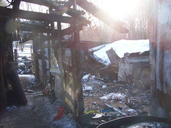 Tragedy hits again for councilwoman Photo provided After the fire, this was the scene at Ada Erik's barn. The snow-covered roof that collapsed is seen on the right.