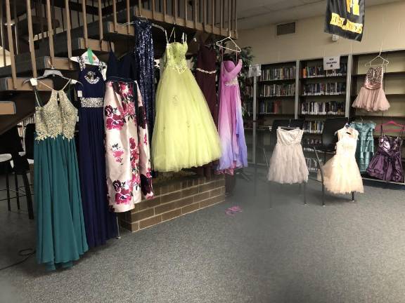Dress sale helps pay cost of prom bids Dresses are displayed in the high school’s lower media center.