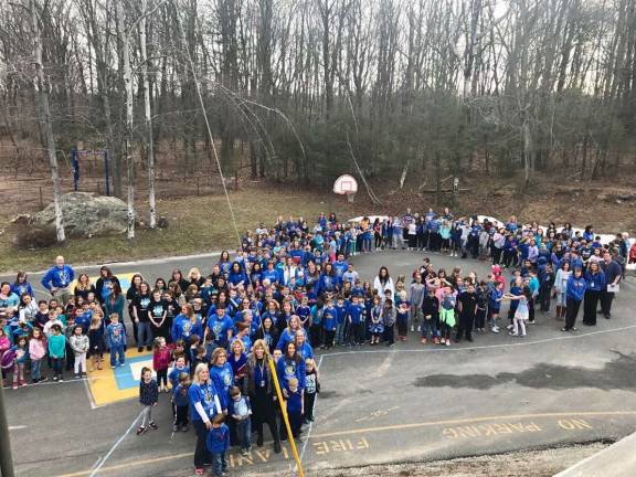 District 'lights it up blue' for autism awareness Maple Road's ribbon.