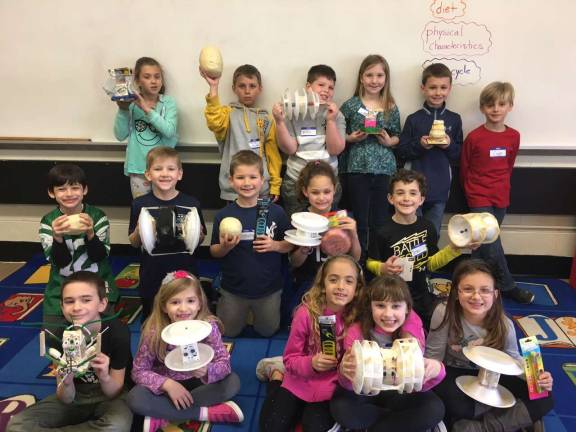 Danielle Rovetto's second graders proudly show their projects, made with the help of AP physics students at West Milford High School.
