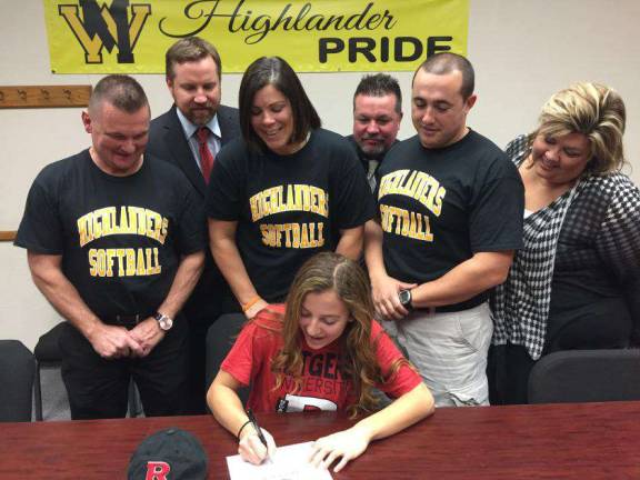 Paige Masiello is seen here signing to play softball at Rutgers-Newark. Surrounding her are WMHS Highlanders softball coaches Mark Mickens, Nicole Gwinett, and Don Dougherty, Guidance Counselor Dana Lambert, Principal Paul Gorski, and West Milford Athletic Director Joe Trentacosta.