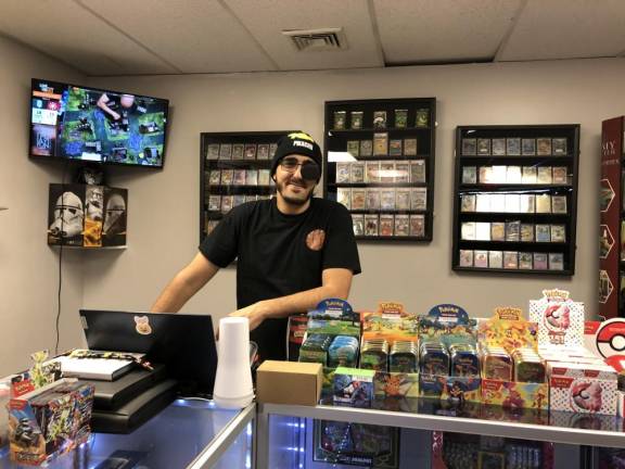 Nicolaus McGarvey will hold a grand opening for Progress CCG (Cards, Collectibles &amp; Games) in Hewitt on Tuesday, Oct. 31. With the business, he aims to recreate the community that he found at his local game store when he was a teen. (Photo by Kathy Shwiff)