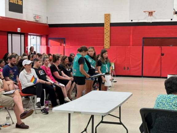 GS1 Girl Scouts Lily Santiago, Kaitlyn Donaldson and Sony Lynn Hart speak to the Board of Education about their Bronze Award project, a Girls Preparing Closet. (Photos provided)