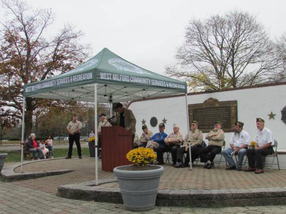 Former Mayor Glenn Wenzel, a veteran, introduces people on the Veterans Day program annually.