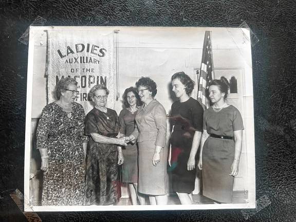 Looking back: Memories of Relda Vreeland Relda Vreeland was a founder of the Macopin Volunteer Fire Company Ladies Auxiliary. She congratulates fellow officers after an election in 1965. From left are treasurer Leslie Weeden, first vice president Vreeland, second vice president Mrs. John Kachler, president Mrs. Walter Bal, secretary Mrs. Walter Bilenski and sergeant at arms Mrs. Ernest Giannini. (File photo by Ann Genader)