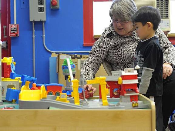 Council to decide fate of preschool Carol Jean Capozzi helping a student with a toy in the West Milford Preschool kindergym on Feb. 5.