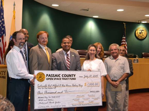 Sustainable West Milford gets 'Dig In' grant Photo provided by Renee Allessio Pictured here, from left, are John Harrison, Freeholder Theodore Best, Freeholder John Bartlett, Freeholder Hector Lora, Freeholder Bruce James, Karen Longo, Freeholder Ronda Cotroneo, David Watson-Hallowell and Freeholder Pat Lepore. Freeholder and West Milford resident Terry Duffy was also missing from this photo.