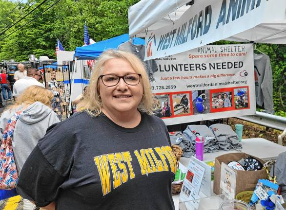Community Day features street fair Mayor Michele Dale stops by the animal shelter’s table.