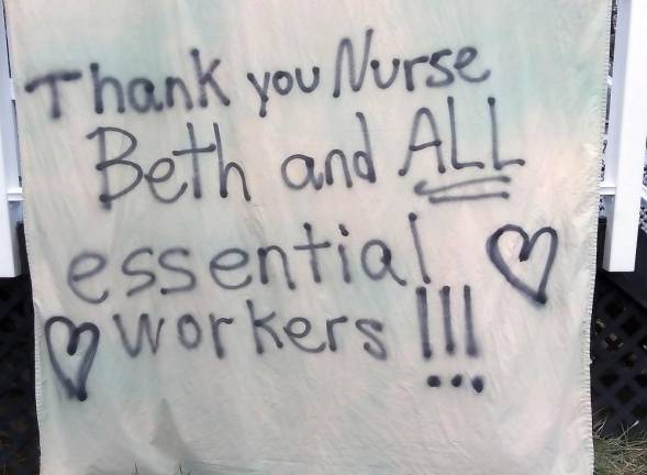 Diane Lungaro shared this image of the sign she made and hung on the front deck for her youngest daughter, Beth Lungaro, who is an emergency room nurse at Mount Sinai Hospital in New York City.