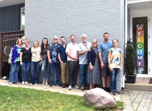 Church celebrates centennial CH2 Pastor Nick Padovani, center in dark blue shirt and church treasurer, Mike MacDonald, in pink shirt, pose with other church board members and volunteers who helped with the centennial celebration.