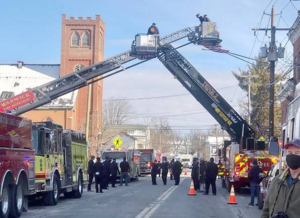 ‘He got cheated out of time, but he didn’t get cheated out of life’ Trucks from the Warwick Fire Department create a bridge along Main Street in the Village of Warwick to welcome Daniel Prial home for the last time. Photo by Terry Reilly.