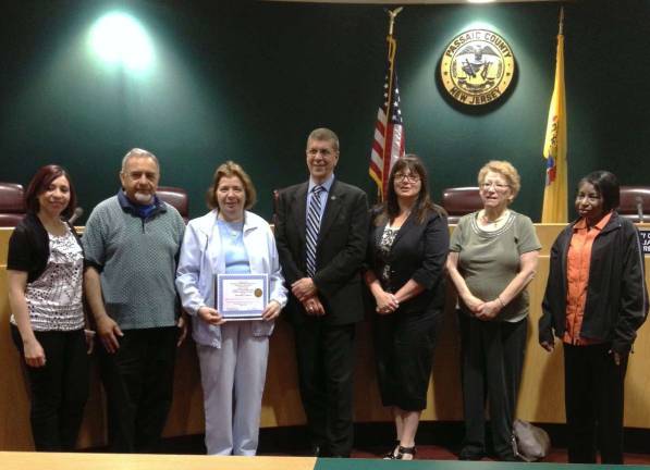 Association for Special Children and Families is a true champion From left, Lili Rodriguez, ASCF staff member, Andrew Abdul, ASCF board member, Angela Abdul, ASCF executive director, Bruce James, Passaic County Freeholder Director, and ASCF staff members Judy Bassford, Julie Rikon, and Edith Felix at the presentation
