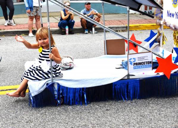 Bed race returns to village Aubrey Boula, granddaughter of Lions Club member Nancy Clifford, rides in the parade.