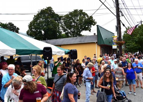 Bed race returns to village The crowd along Windermere Avenue waits for the bed race.