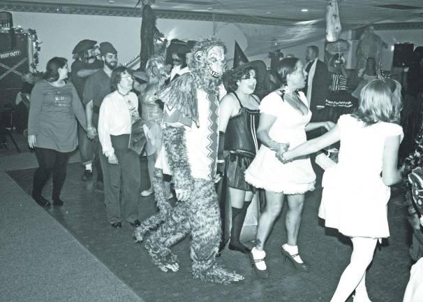 Elks Halloween dance is a real scream Photos by Ginny Raue Halloween makes for a strange mix on the dance floor.