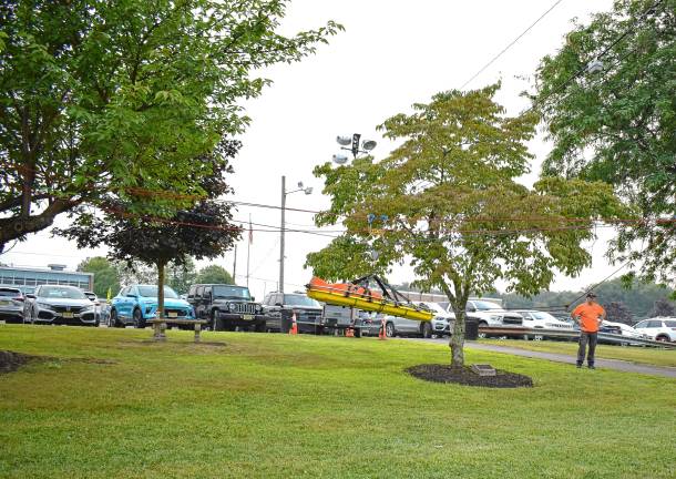 Community gathers for National Night Out A gurney is lifted on ropes.