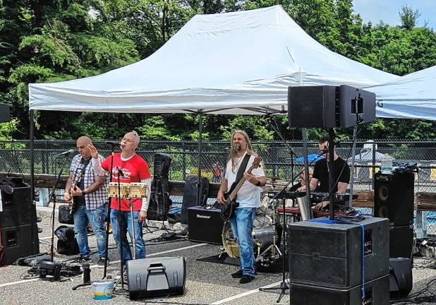 Community Day features street fair Cover band Mr. Lovejoy entertains at the event.