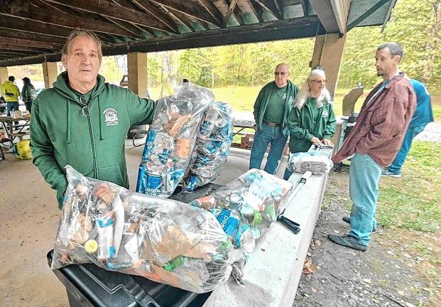 Volunteers clean up roadsides JB1 James Bennett holds up bags of litter picked up from West Milford roadsides Saturday, Oct. 11. (Photos by Rich Adamonis)