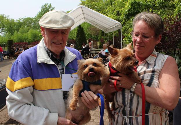 Goin' to the dogs George and Fran Robinson brought their two Yorkies to the show. These two adorable little dogs won for "Best Name" - Trek, named for "Star Trek" and Shea, named for the stadium.