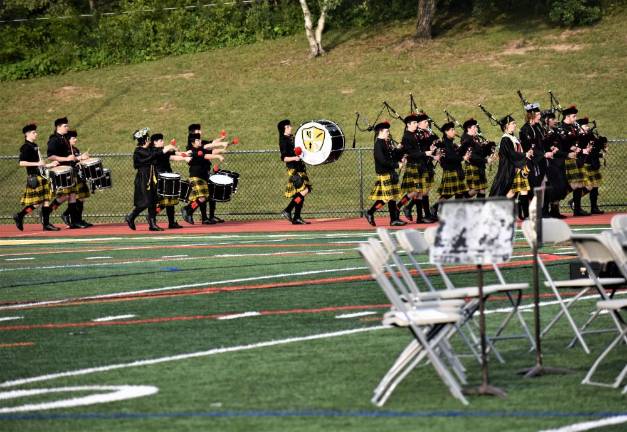 The Highlander Marching Band led the graduates to their seats.