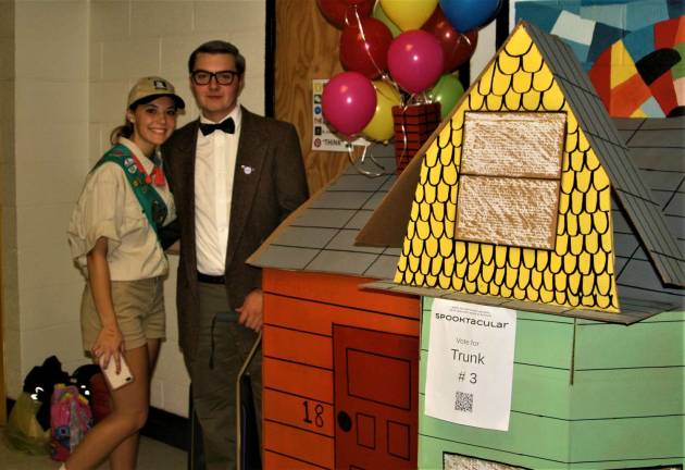 High school students Jordyn Gerold, 17, and Ryan Browne, 18, host one of the more than 25 &#x201c;trunks&#x201d; handing out treats during the Spooktacular event on Saturday at West Milford High School.