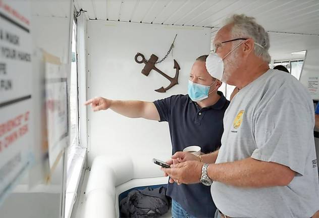 U.S. Rep. Josh Gottheimer visited Greenwood Lake Thursday, Aug. 6, along with New Jersey Chair of the Greenwood Lake Commission Paul Zarrillo (right) and local officials to view toxic algae impacting the lake, recreation and local businesses. Provided photos.