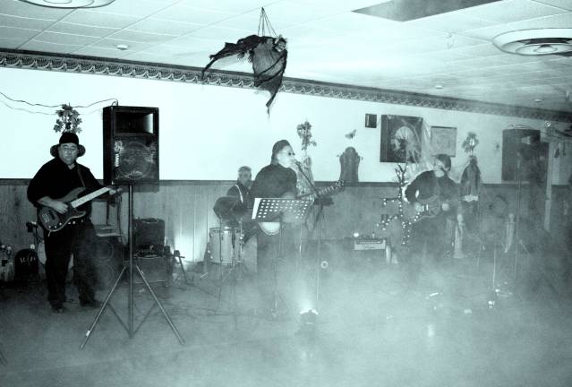 Elks Halloween dance is a real scream "The Shed Band" played through the eerie fog.